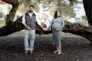 Pregnant woman standing by lake, Perth