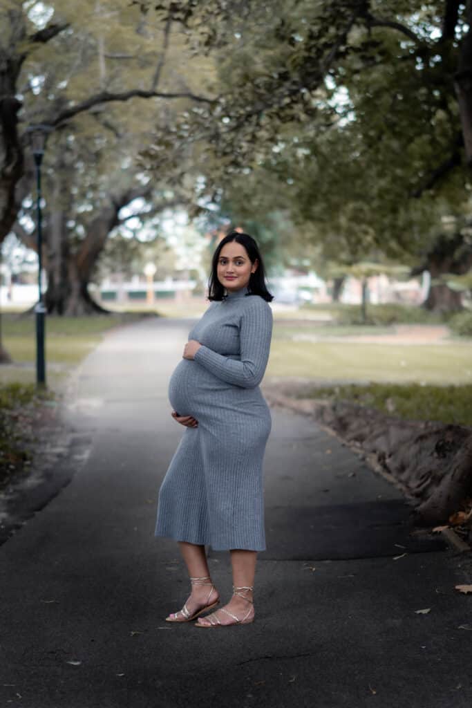 Couple holding hands during maternity session, Perth