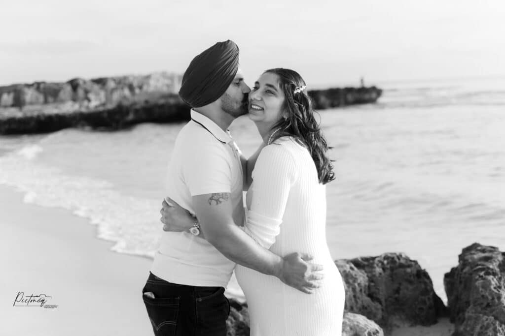 Maternity shoot with Perth city skyline in distance, Trigg Beach